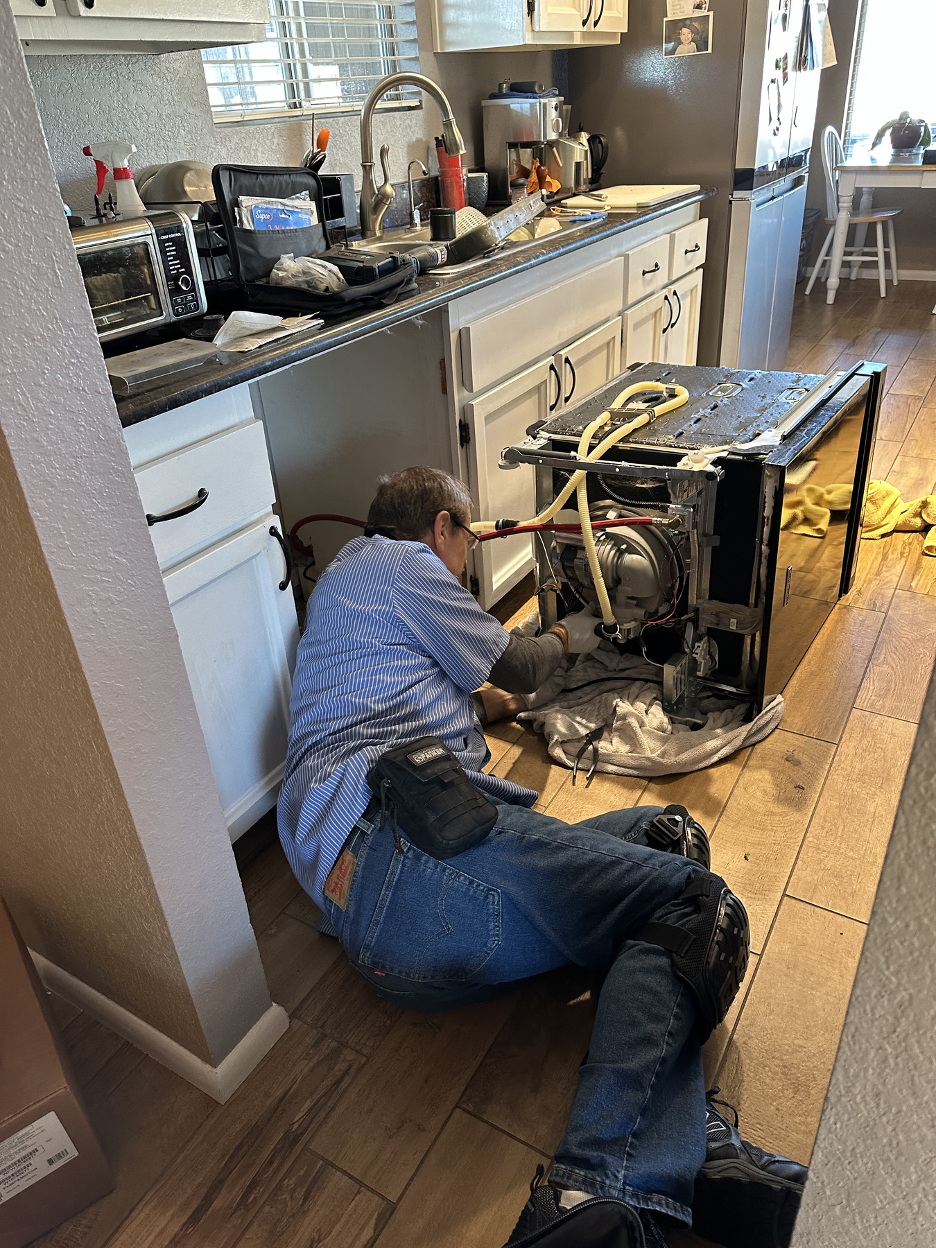 Dishwasher opened for service in a Tucson home